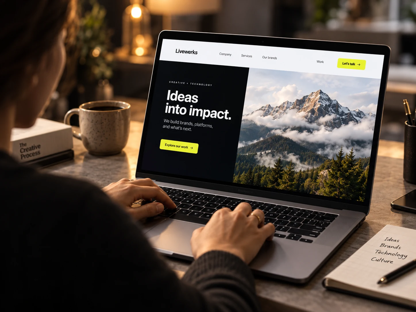 Livewerks website displayed on a laptop with mountain imagery and the headline Ideas into impact.